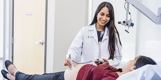 Female doctor performing an ultrasound at UC Riverside Medical Center