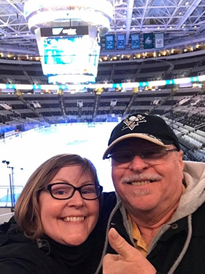 Lisa and her father at hockey game