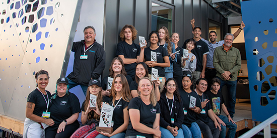 Jennifer Wilkins (front row, center) and teamMADE participants in front of the award-winning luminOCity house