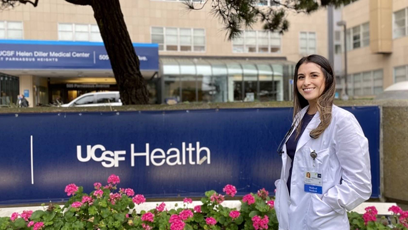 Dr. Vanessa Mora Molina in front of a UCSF Health sign