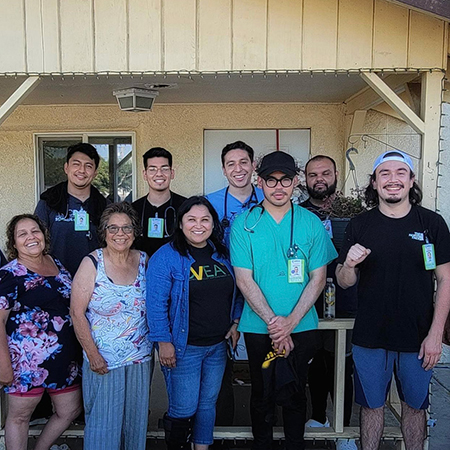 UC Davis medical student Javier Rodrigeuz (back row, second from right) with his fellow UC PRIME classmates and community members at a pop-up clinic they staffed in the small Central Valley community of Poplar-Cotton Center.