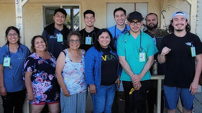 UC Davis medical student Javier Rodrigeuz (back row, second from right) with his fellow UC PRIME classmates and community members at a pop-up clinic they staffed in the small Central Valley community of Poplar-Cotton Center. 