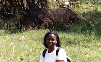 Dr. Cené as a child with a rhino