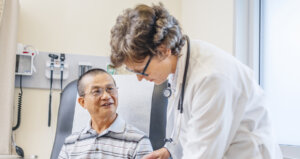 doctor examining an older patient