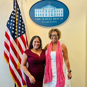 WorkLife Law Co-Director Jessica Lee and WLL Board Member Tina Sherman celebrate the 60th anniversary of Title VII at a White House event July 29