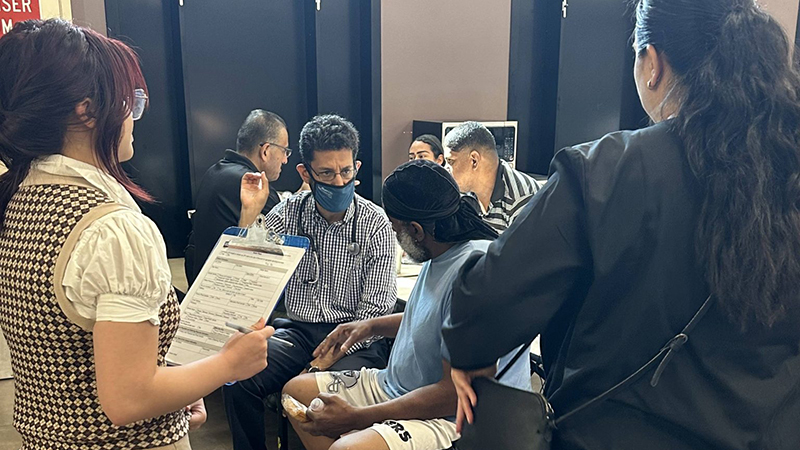 Doctor speaking to mother and child