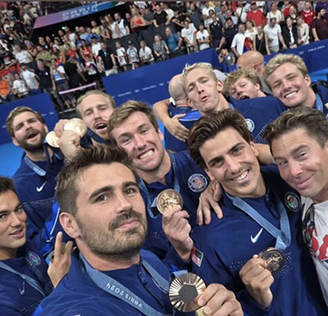 U.S. men’s water polo team taking a selfie with their medals.