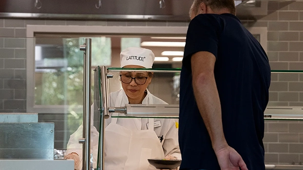 Maryann Estrada serves shrimp and grits