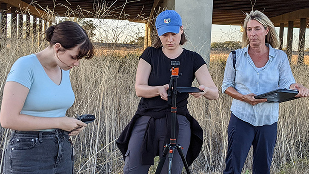 Sarah Lagattuta, Janna Freeman, and Christine Kreuder Johnson of UC Davis One Health Institute set up to record video and audio data of wildlife at a wetland in California's Sacramento Valley. 