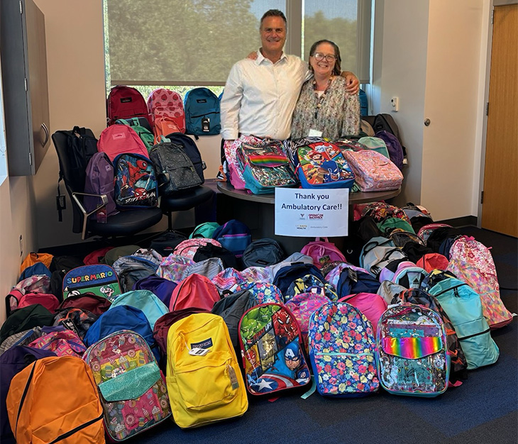 Ambulatory care employees were eager to collect backpacks and cash for the annual donation drive.