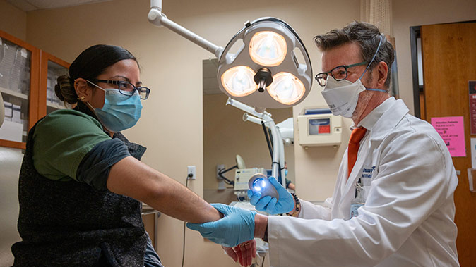 UC Davis Health doctor treating a patient