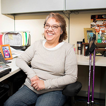 Carol Music at her desk