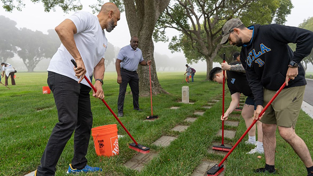 UCLA volunteers cleaning headstones