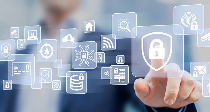 Business person touching screen with cybersecurity icons