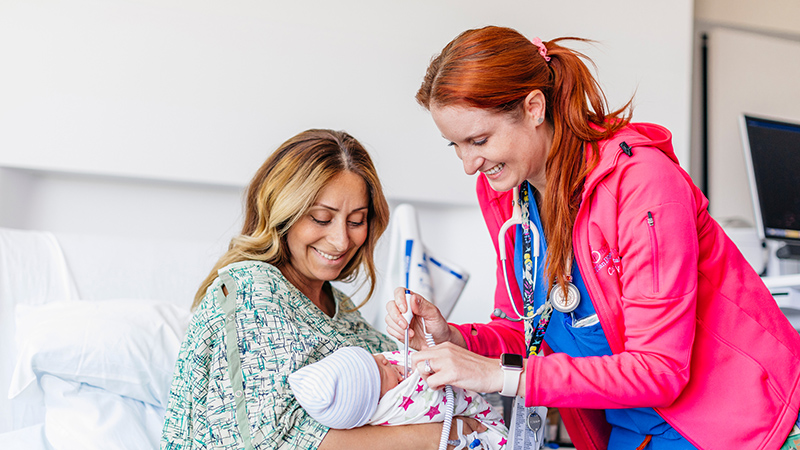 A new mother cares for her baby at UC San Diego Health.