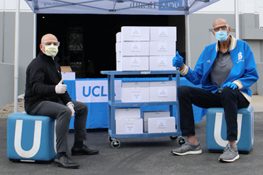 UCLA’s Dr. Eric Esrailian and Mr. Abdul-Jabbar with 900 pairs of safety goggles