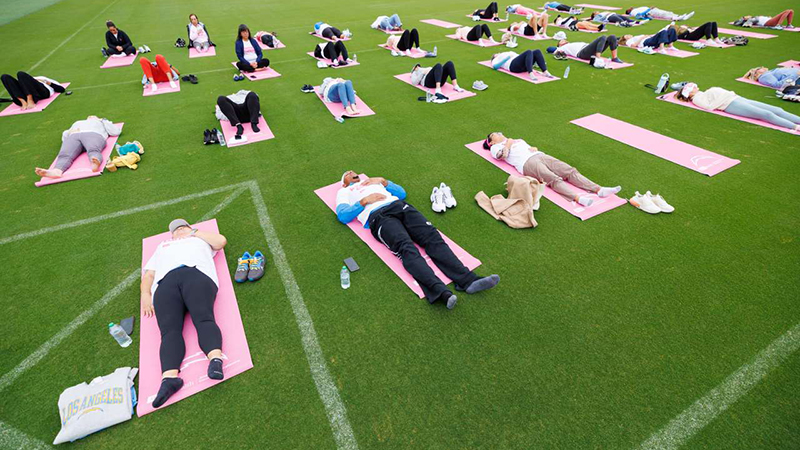 UCLA cancer patients attend a morning breathwork workshop at Chargers' practice space