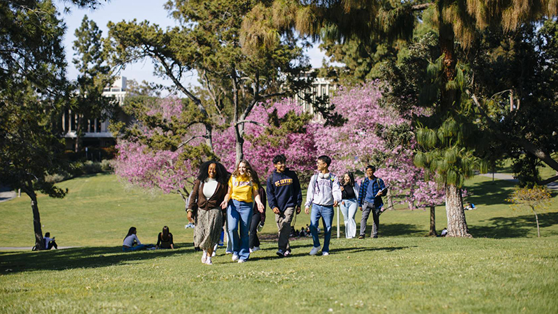 UC Irvine students walking across campus