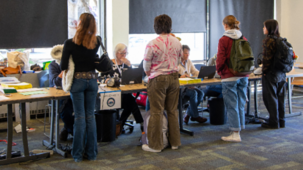 Volunteers check in voters at UC Santa Cruz