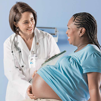 Doctor holding pregnant woman's belly