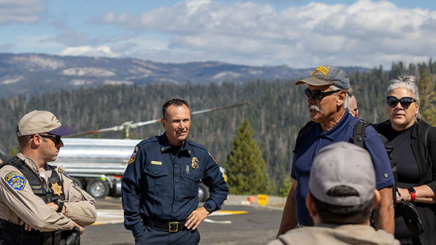 Seminar participants meet with representatives from California Highway Patrol, Cal Fire and the Yosemite National Park Rescue team at the Crane Flat Heli-base. Photo courtesy of Jordan Reinsma.