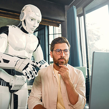 Robot looking over man's shoulder