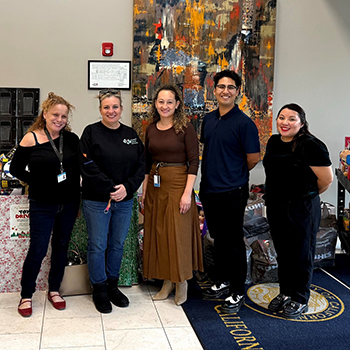 UCPath and Walden Family Services staff with toy drive donations