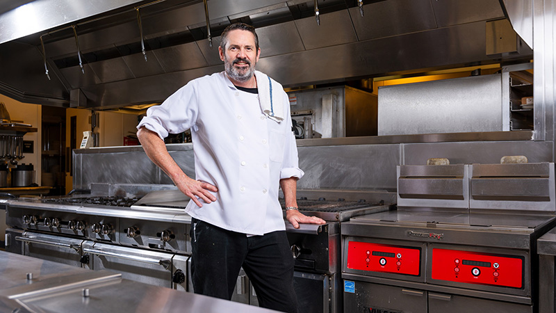 Chef Hayden Dozier in the kitchen at The Club & Guest House