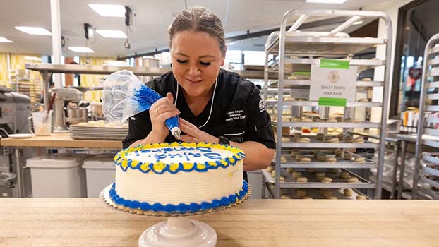 
Allison Eagan, executive pastry sous chef, decorates a custom-made cake 