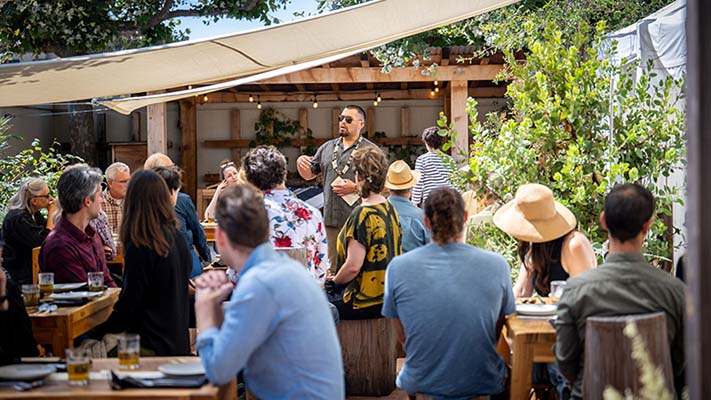 Vincent Medina speaks during a meal 