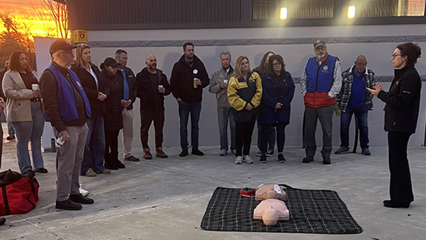 Project ADAM coordinator Rebecca McCormac provides hands-only CPR training and demonstrates how to use an AED.