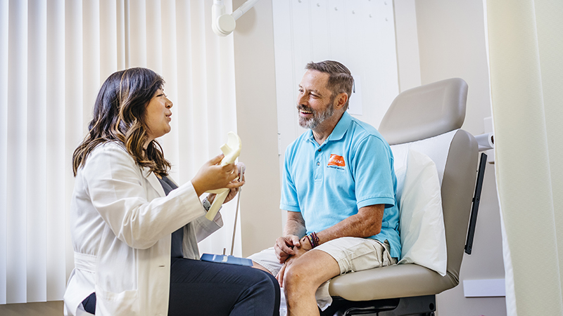 A doctor talks with a patient at UCR Health Palm Desert Family Medicine