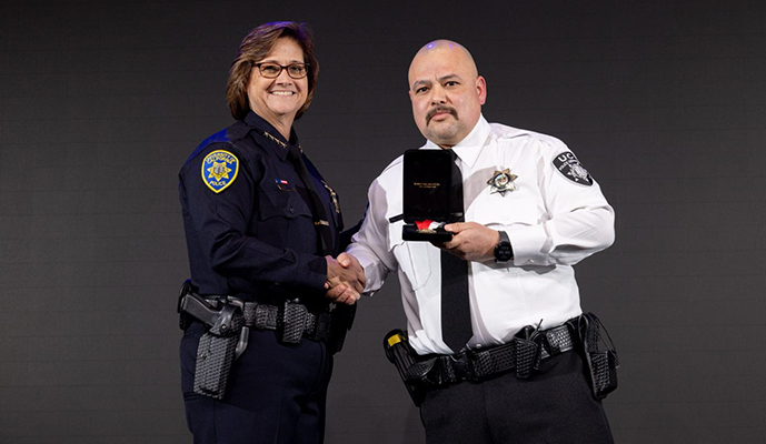 UC Irvine Police Department Chief Liz Griffin presents the Lifesaving Award to Public Safety Responder Jose Gallardo.