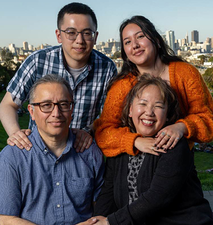 Mario and Esther Carmona with their children, Antonio and Brianna, all UCSF employees, at Mission Dolores Park in San Francisco