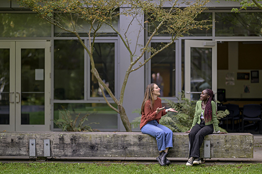 women talking outdoors