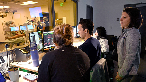 Dr. Cecilia Canales works with residents and staff during an OR simulation at the UCLA Simulation Center in Rosenfeld Hall.