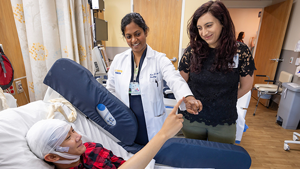 UC Davis doctor greets child wearing epilepsy headwear