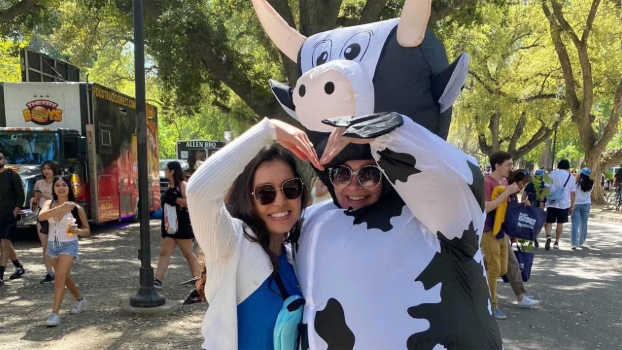 Jennifer Zuniga and Sierra Ronning in cow costumes