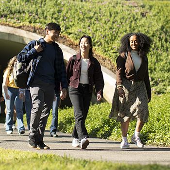 UC Irvine students walking in Aldrich Park