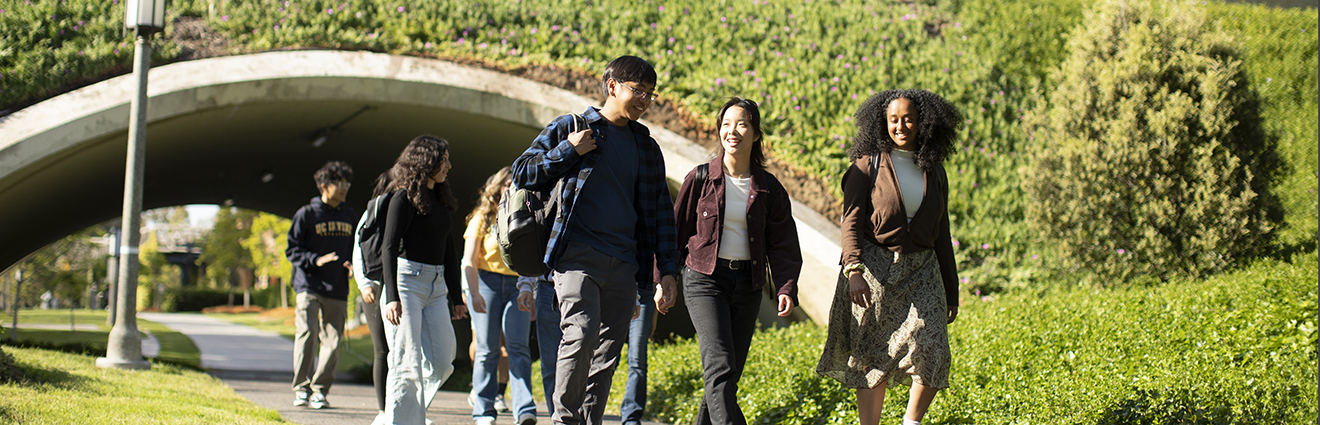 UC Irvine students walking in Aldrich Park