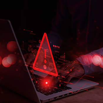 System hacked warning alert on notebook computer
