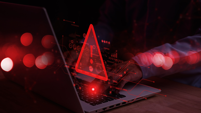 System hacked warning alert on notebook computer
