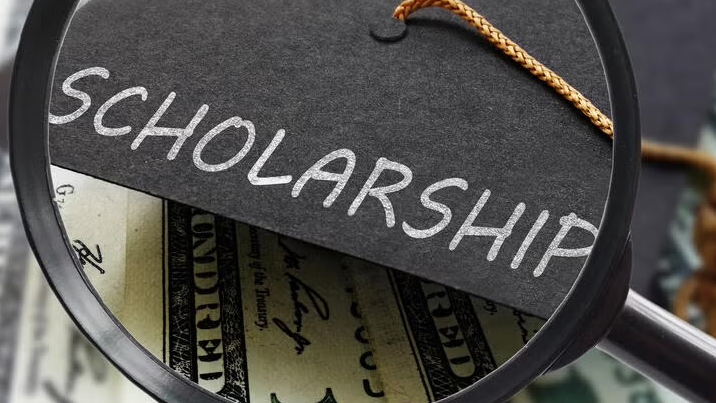 Magnifying glass over the word "scholarship"