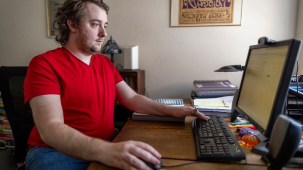 Sean Mini uses a computer