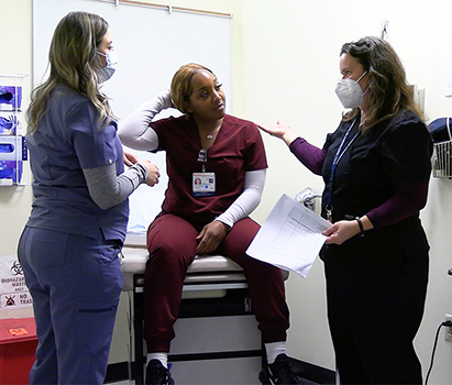 Bridget Gramkowski speaking with colleagues