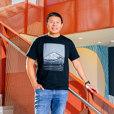 Brian Choi in front of his mural at UC San Diego