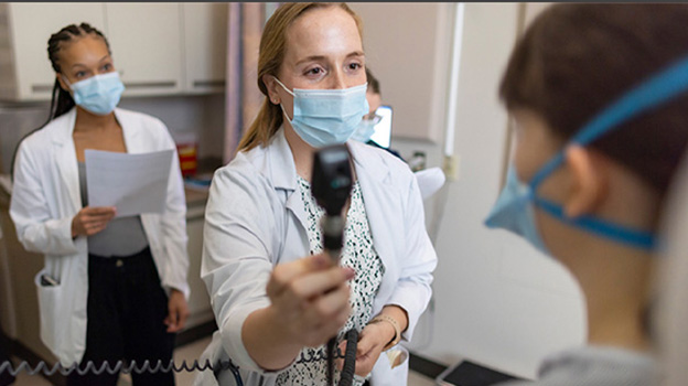 Nurses examining a patient