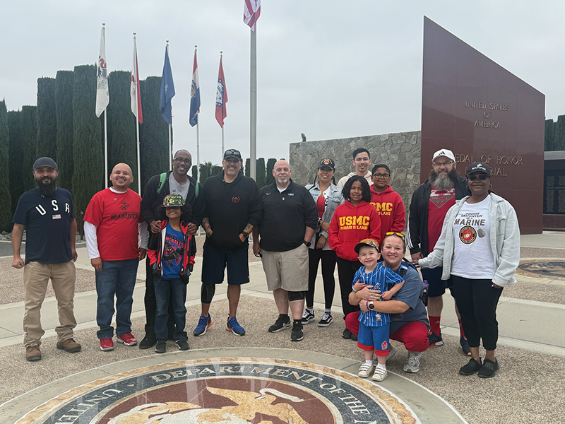 VAUS members standing together by cemetery entrance