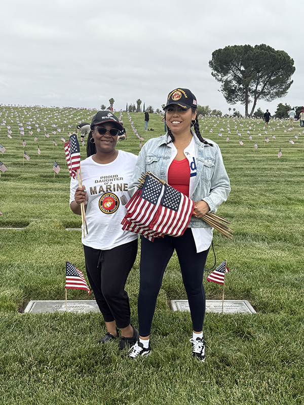 Two women holding American flags