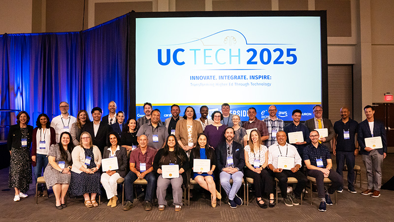 Group of people holding award certificates